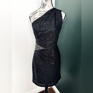 Size 8 Jackie Jon black one shoulder cocktail dress. In excellent condition.